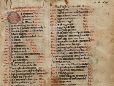 A medieval manuscript showing a list with a red and blue illuminated letter at the top left corner.